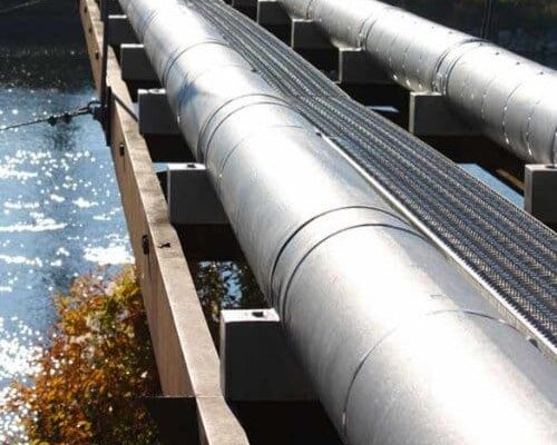 Pipe Insulation By Dragon Jacket Installed On Raised Sewer Pipes