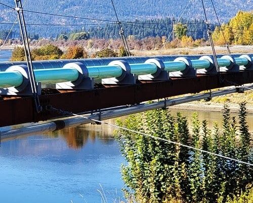 dragon jacket insulation insulated pipe saddles installed on sewer main suspension bridge in bonner's ferry, idaho